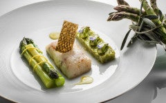 Guest recipe: Philippe Jourdin’s line-caught seabass cooked on fennel wood and green asparagus with a black olive oil emulsion