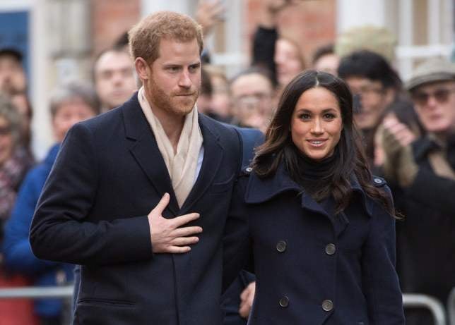 Prince Harry and Meghan Markle - Duke and Duchess of Sussex walking arm in arm