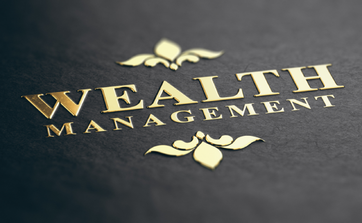 Gold "Wealth management" icon on a black leather book