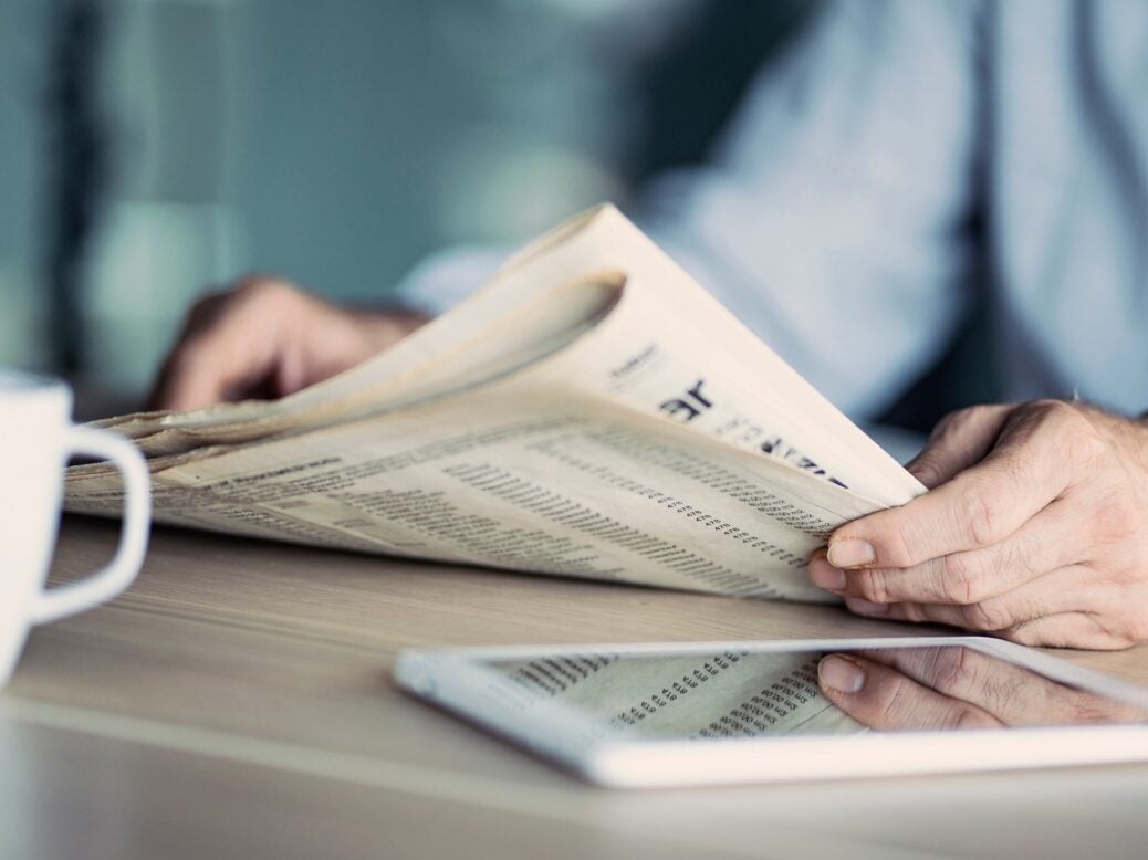 businessman reading newspaper