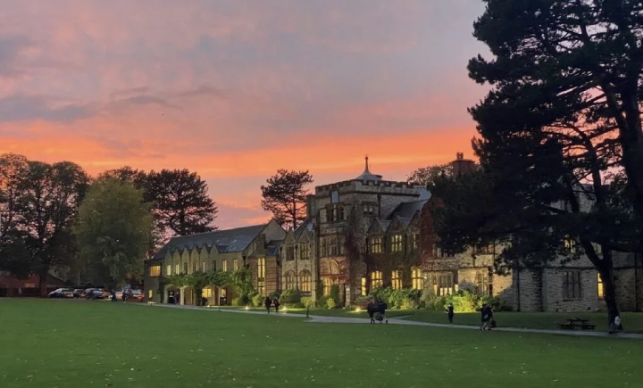 Ruthin School at sunset, with a pink and purple sky