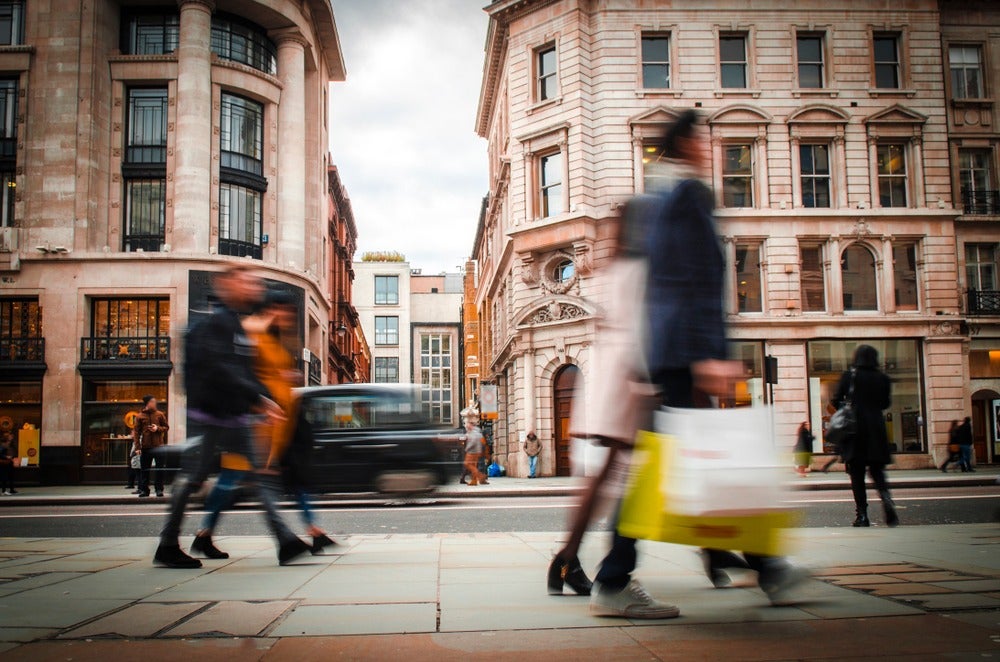 shoppers on a London street super-prime commercial property