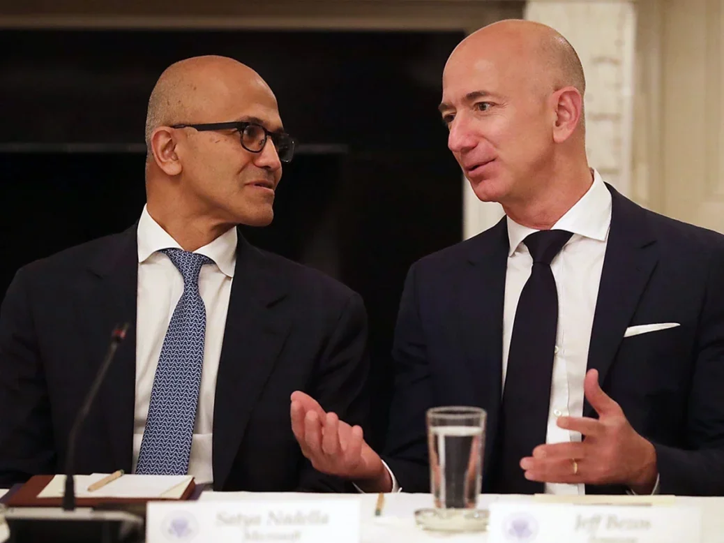 Microsoft CEO Satya Nadella (L) and Amazon CEO Jeff Bezos