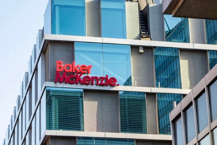 The building with a red logo of Baker McKenzie international law firm.