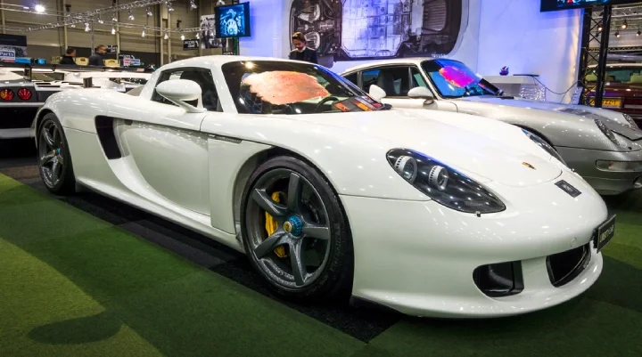 White 2005 Porsche Carrera GT at a car exhibition 