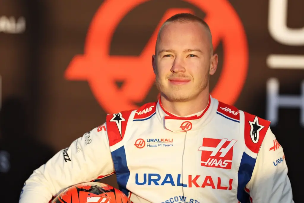 Nikita Mazepin holding his helmet under his arm