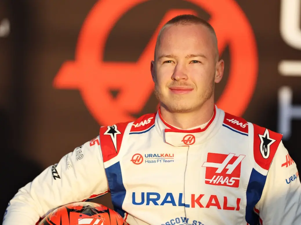 Nikita Mazepin holding his helmet under his arm