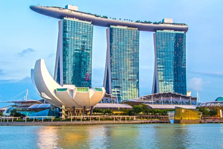 View from the bay of Marina Bay Sands’ three towers on a sunny day in Singapore