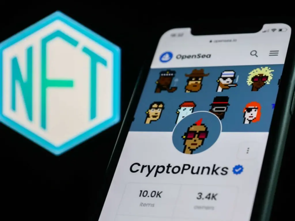 Phone with CryptoPunks uploaded and NFT logo in the background