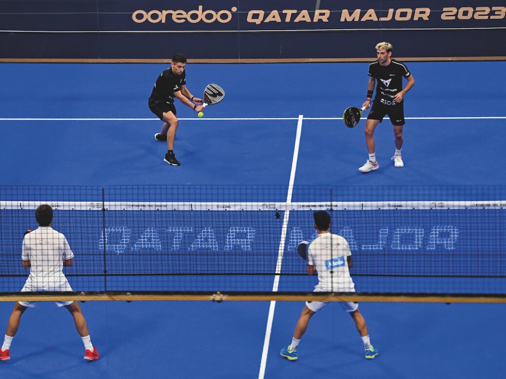 Franco Stupaczuk and Martin Di Nenno of Argentina (top) in action during the final match of the Oredoo Qatar Major Premier Padel 2023 against Fernando Belasteguin and Carlos Daniel Gutierrez of Argentina at the Khalifa International Tennis Complex in Doha, Qatar, 05 March 2023. Franco Stupaczuk and Martin Di Nenno won 6-2,7-6.