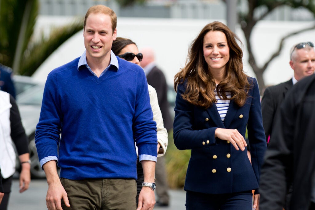 Duke and Duchess of Cambridge walking along smiling 