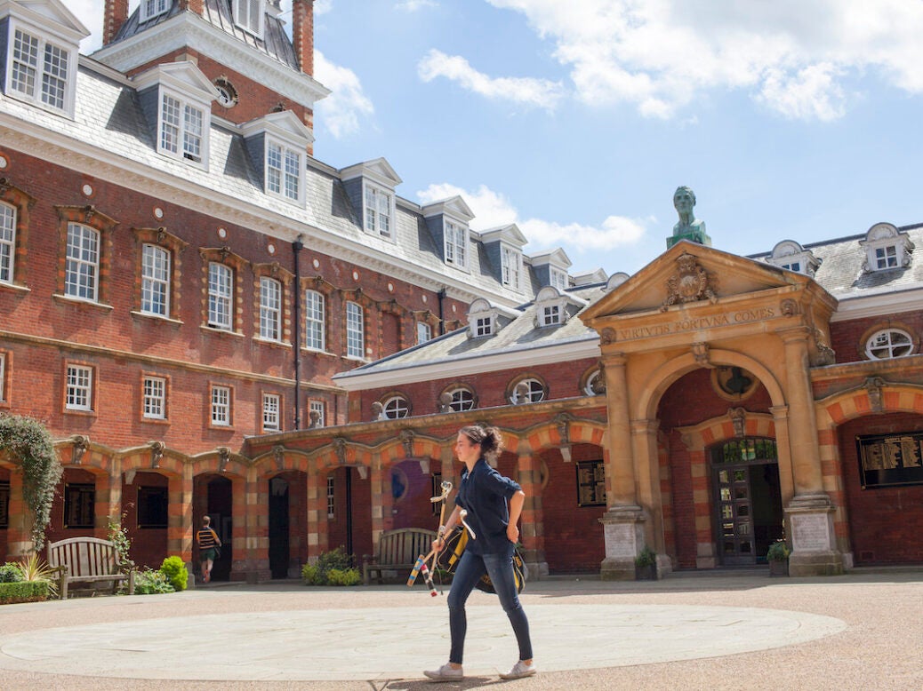 A pupil at Wellington College makes their way to the playing fields for games.