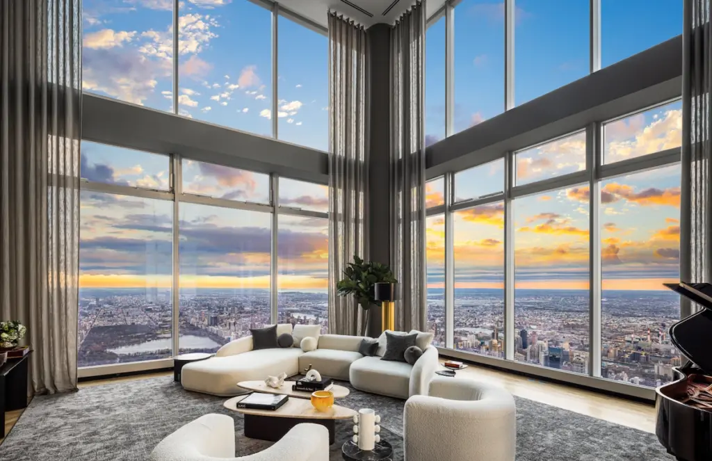 The living room of Central Park Tower Penthouse with view across Manhattan 