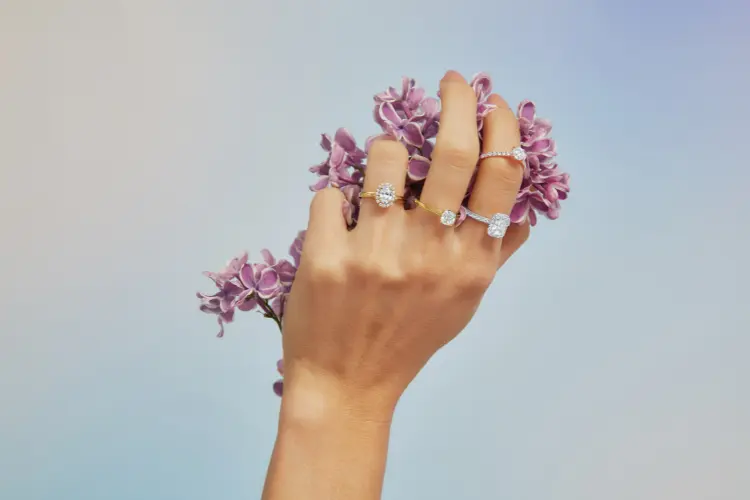 A woman wearing Skydiamond rings