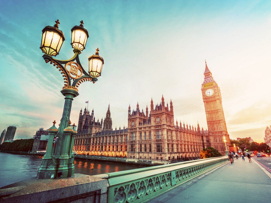 Big Ben seen from Westminster Bridge, London, the UK. at sunset. Retro street lamp light. Vintage