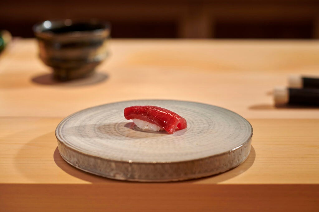 A piece of sushi on a serving plate