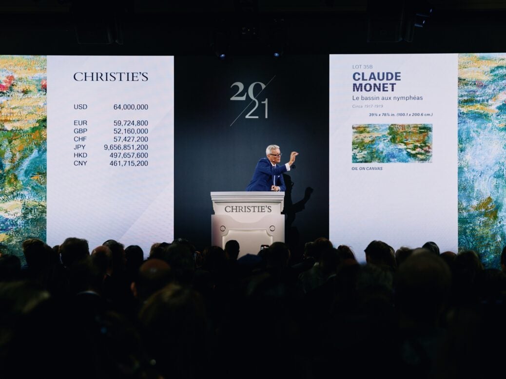 Jussi Pylkkänen, Christie's auctioneer and global president, sells the top lot of the 20th Century Evening Sale, Claude Monet’s Le bassin aux nymphéas for $74,010,000