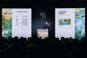 Jussi Pylkkänen, Christie's auctioneer and global president, sells the top lot of the 20th Century Evening Sale, Claude Monet’s Le bassin aux nymphéas for $74,010,000