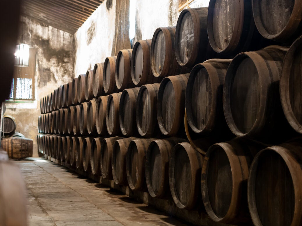 Production of fortified jerez, xeres, sherry wines in old dark oak barrels in sherry triangle, Jerez la Frontera, El Puerto Santa Maria and Sanlucar Barrameda Andalusia, Spain
