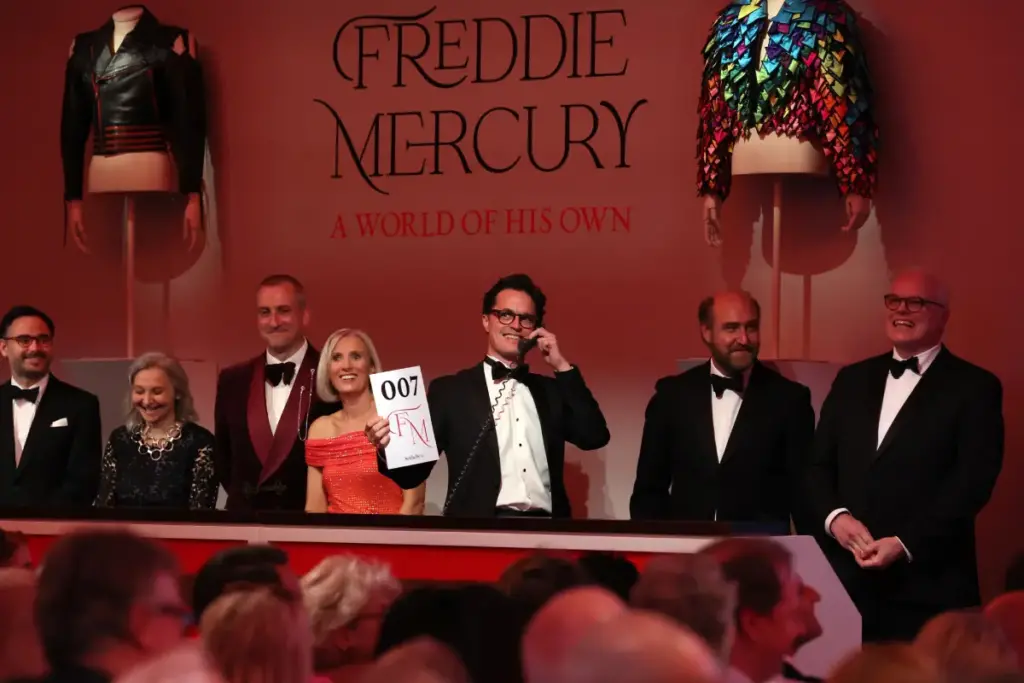 Freddie Mercury Auction with items for sale an auctioneer fielding bids