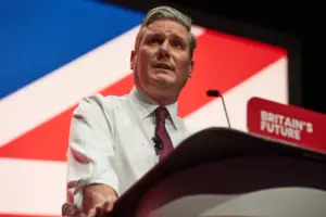 Keir Starmer at the podium with the union jack behind