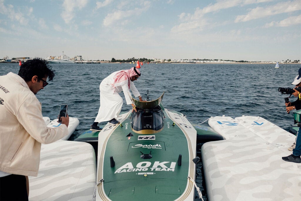A spectator explores a Team Aoki vessel at the E1 race in Saudi Arabia 
