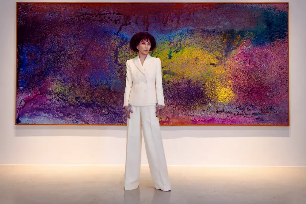 Pearl Lam standing in front of a painting