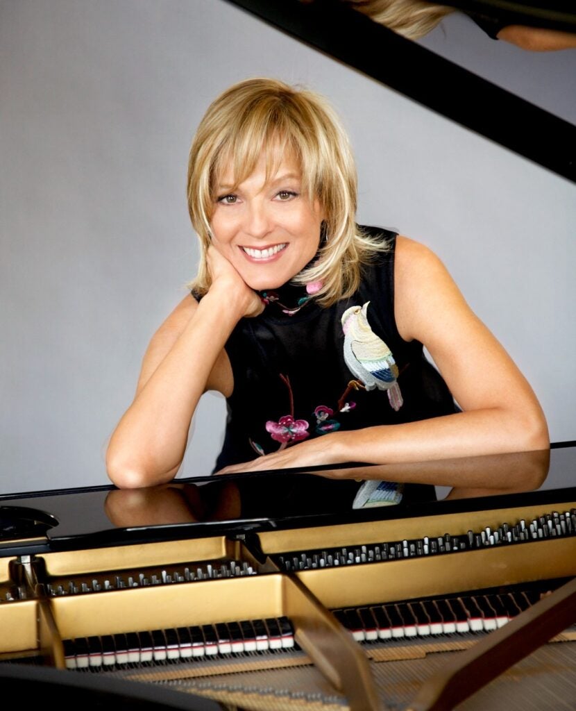 Helene Mercier has been part of the Arnault family for over 30 years. In the picture, she is shown with a piano.