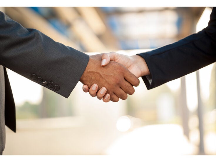 Stock image of two people shaking hands